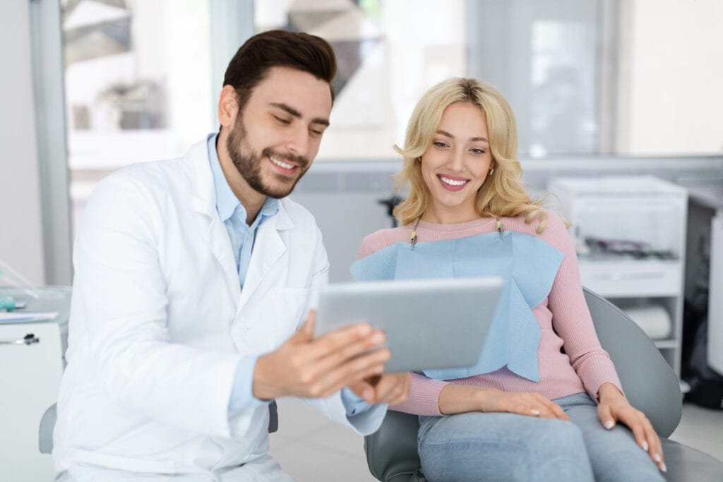 Dentist discussing dental implant costs with a patient