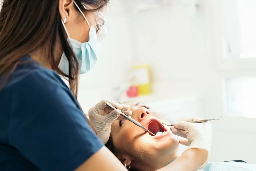 Dentist discussing a routine dental check-up with a patient