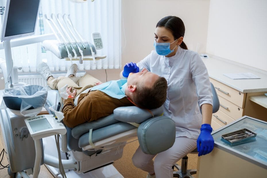 Home visit dentist treating a patient in Cardiff